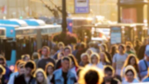 A crowd of people is walking down the street 스톡 동영상 283379557