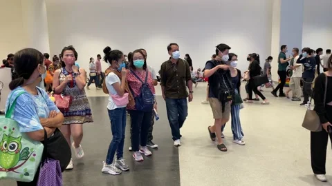 Crowd of people walking inside Queen Sirikit National Convention Centre Video stock 219741741