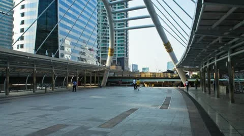 Crowd of people walking next to sky train station in Bangkok Stock Footage 10683836