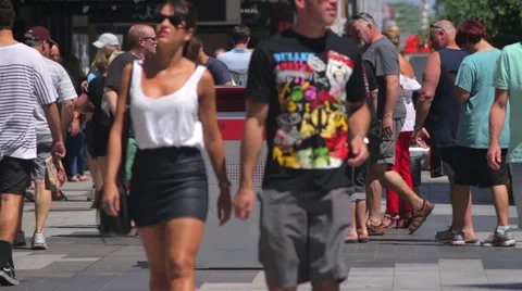 Crowd of People walking past bin in a Busy Mall Stock Footage 54719838