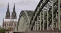 Crowd People Walking Rush Hour Establishing Shot Iconic Bridge Cologne Skyline HD Footage