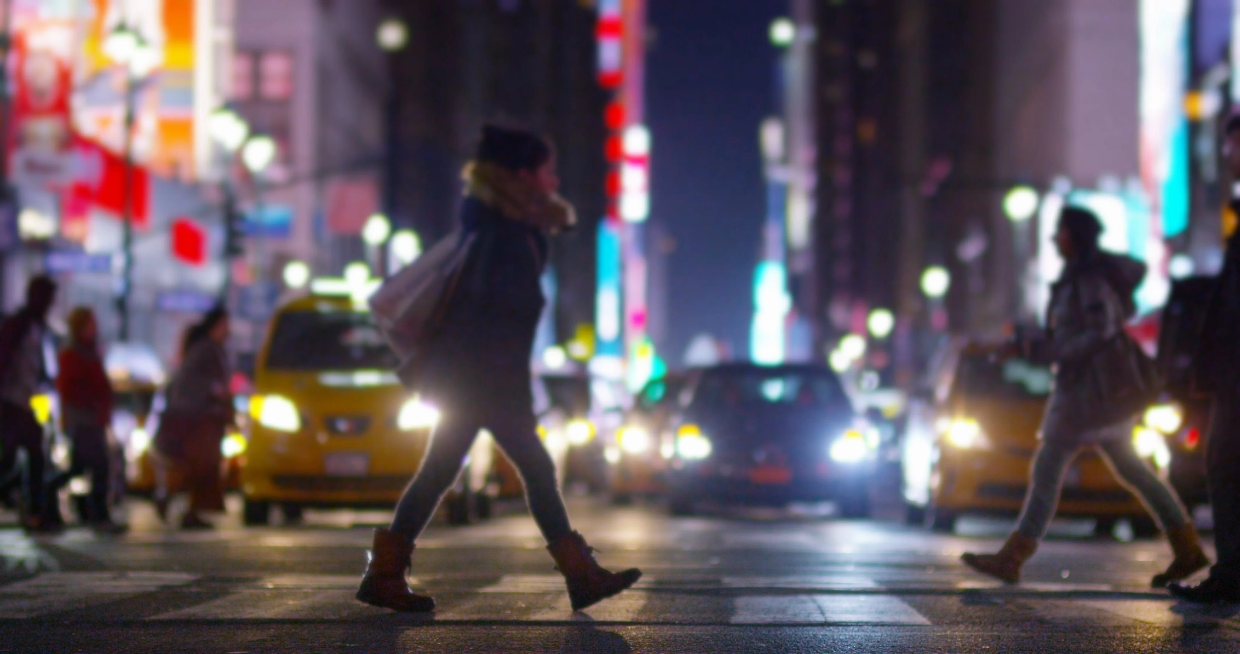 new york city people walking at night