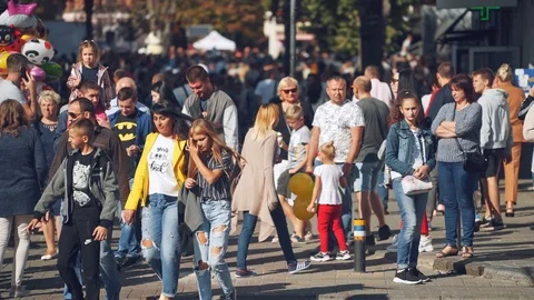 Crowd of people walking on streets Stock Footage 121506321