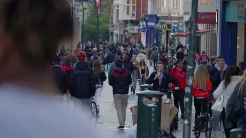 Crowd of people walking through a busy pedestrian zone - Grafton Street Dublin Stock Footage 187697079