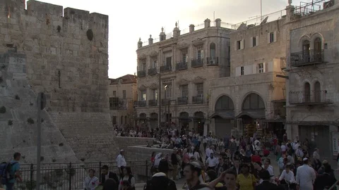 Crowd of people walking through Jerusalem Streets outside Old City Stock Footage 86759464