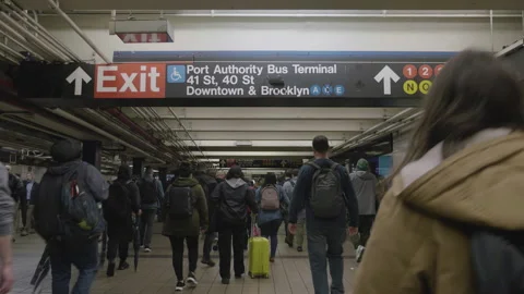 Crowd of people walking through New York City's Port Authority Bus Terminal Stock Footage 273443852