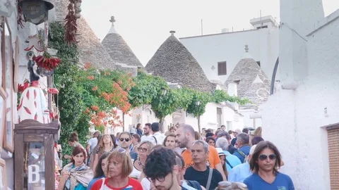 Crowd of people walking through Trulli Village- 7 august 2017, Alberobello,Italy Stock Footage 82763208