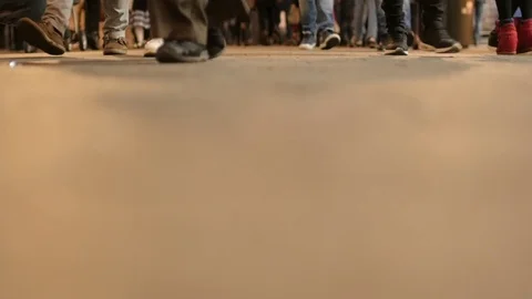 Crowd of people walking towards camera. Low angle. Cool abstract background. Video stock 73480229