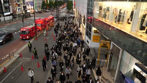 Crowd of people walking towards train station after work. Tokyo, Japan. Stock Footage 249661852