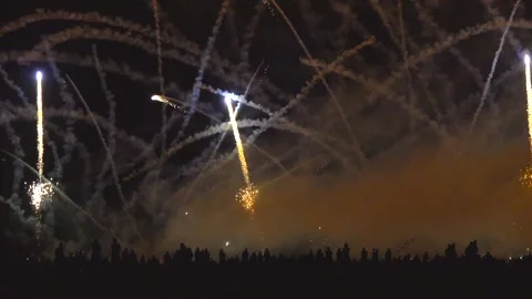 Crowd of people watch Breathtaking spectacle of international fireworks festival Stock Footage 283429952