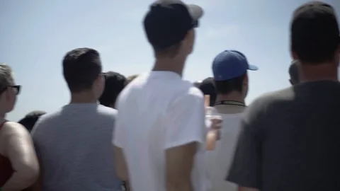 Crowd of People Watching Event Outdoors Stock Footage