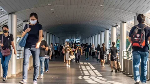 Crowd people wearing protective face mask for protect Coronavirus,Covid 19 Stock Footage 129024412