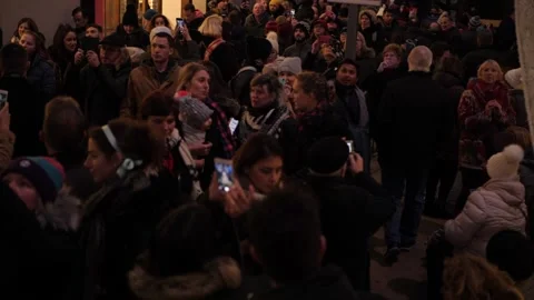Crowd of people at a winter night looking at something [SloMo] Stock Footage 164110205