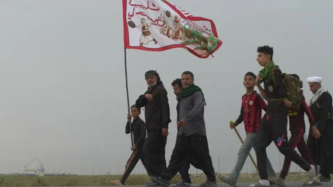 Crowd of pilgrims walking in Arbaeen pilgrimage in Karbala, Iraq Video stock 136437182