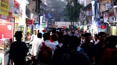Crowd of ppeople walking toward a local railway station | Mumbai Stock Footage 272613883