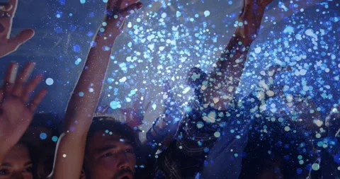 Crowd pressing forward, raising hands and calling out in concert, blue particles Stock Footage 334034826