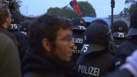 Crowd protest, Palestine flag demonstration, riot police, Berlin Stock Footage 90038107