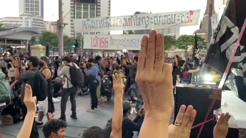 Crowd protest at Victory monument three finger salute sing national anthem Video stock 215921445