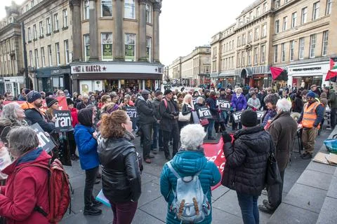 Crowd of Protesters with Don't Attack Iran signs at a public demonstration. Stock Photos