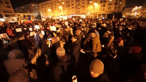 Crowd of protesters jumping and holding signs Stock Footage 90126329