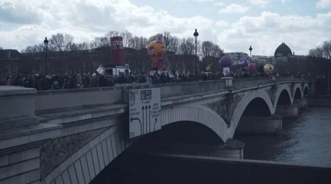 Crowd protesting for El Khomri over a bridge, Bastille Stock Footage 62583097