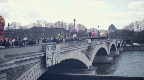 Crowd protesting for El Khomri over a bridge Stock Footage 62583105