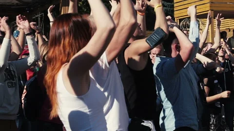 Crowd raise hands up, dance at party. Slow motion Stock Footage 54134602