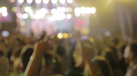 crowd raises his hands to the music during a rock concert Stock Footage