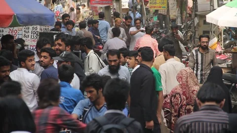 Crowd rush and traffic move along Mobile Market Hall Road Stock Footage 86623931