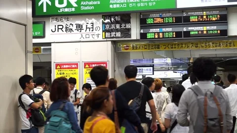 Crowd rushing through JR train gate signages at Akihabara station 스톡 동영상 71541454