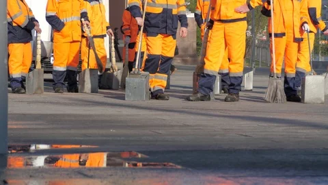 Crowd of service workers in orange work suits Stock Footage 107620274