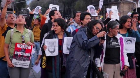Crowd shouting slogans in a march protest for the students disappeared Guerrero Stock Footage 44348746