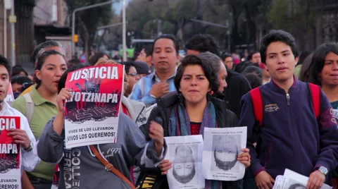 Crowd shouting slogans in a march protest for the students disappeared Guerrero Stock Footage 44349030