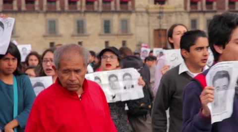 Crowd shouting slogans in a march protest for the students disappeared Guerrero Stock Footage 44351032
