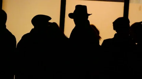 Crowd of silhouette people walking in fr... | Stock Video | Pond5