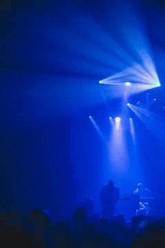 Crowd silhouette watching rock concert. Stock Photos