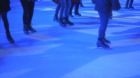A crowd skating at night on a ice ring at night. Stock Footage 144802305