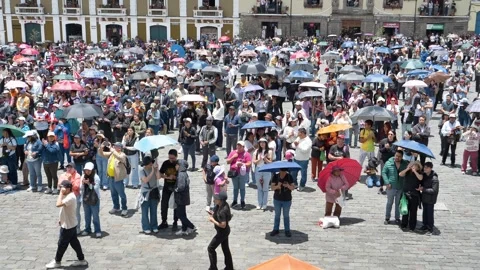 Crowd of spectators with umbrellas watching the Jesus del Gran Poder procession Stock Footage 333485150