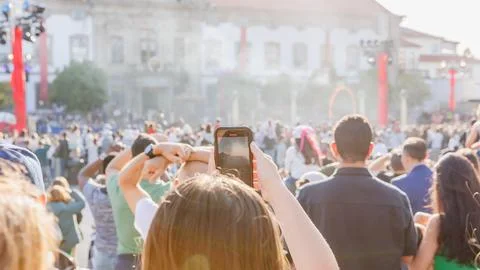 Crowd of spectators watching a show in front of the town hall of Braga, Por.. Stock Photos