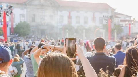 Crowd of spectators watching a show in front of the town hall of Braga, Por.. Stock Photos