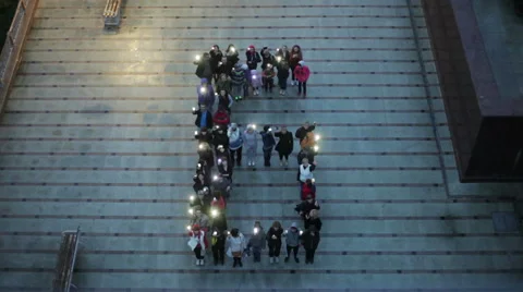 Crowd standing in the form of letters Stock Footage 61261374