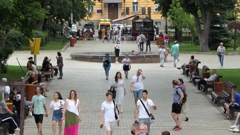A crowd of strolling townspeople, visiting people - on the boulevard. Stock Footage 134331398