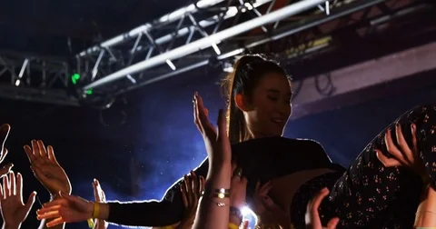 Crowd surfing at a concert 4k Stock Footage