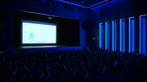 Crowd of Tech People in Cinema Theater Watching High Tech Product Presentation Stock Footage 126502707