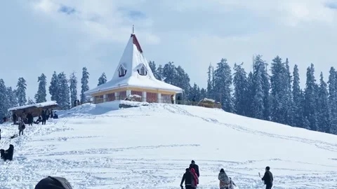 Crowd of tourists enjoying in front of the shiv temple in Gulmarg golf course Stock Footage 307006068