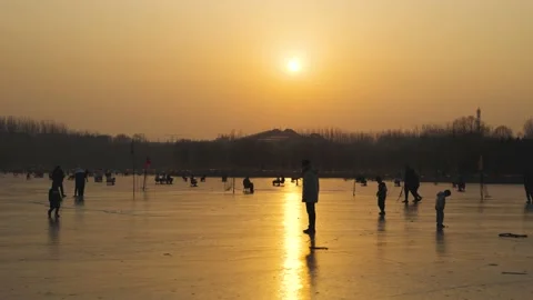 Crowd of tourists skating on ice at sunset Stock Footage 235459902