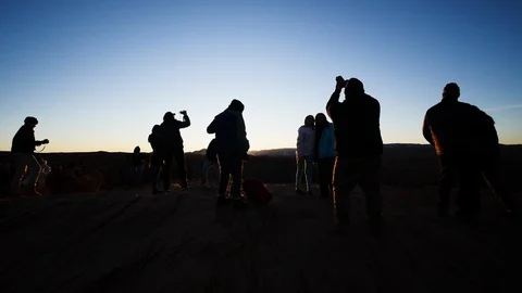 Crowd of Tourists Taking Selfies at Sunset Stock Footage 123298636