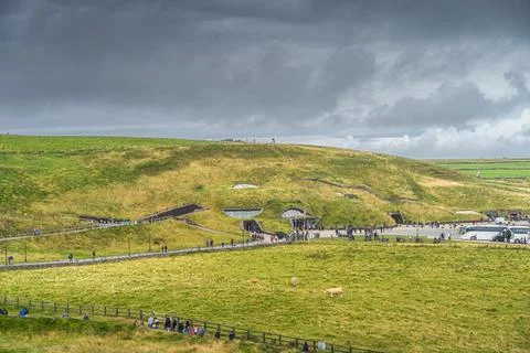 Crowd of tourists visiting iconic Cliffs of Moher, main visitor centre, Ireland Stock Photos