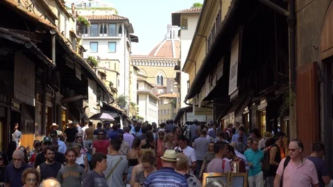 Crowd of tourists visiting Ponte Vecchio Bridge. Florence, Italy. Stock Footage 94965537