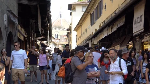 Crowd of tourists visiting Ponte Vecchio Bridge. Florence, Italy. 4K Stock Footage 94965564